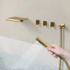 94c6ddb17b8ed2eee02ab38e9ca5998a Luxury Brushed Gold Deck-Mounted Waterfall Bathtub Faucet with Hand Shower